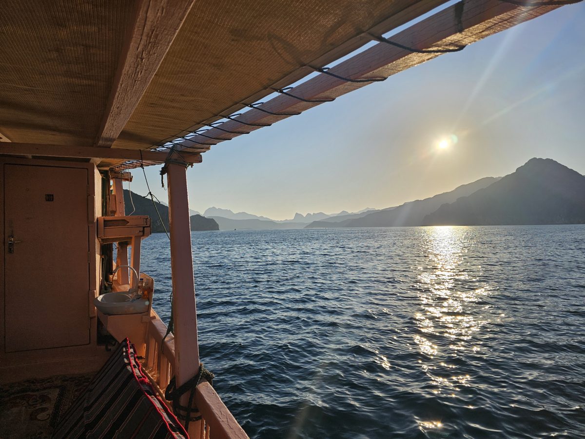 Morning sun over a fjord in Oman, seen from a dhow